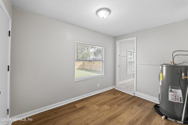 utility room with water heater