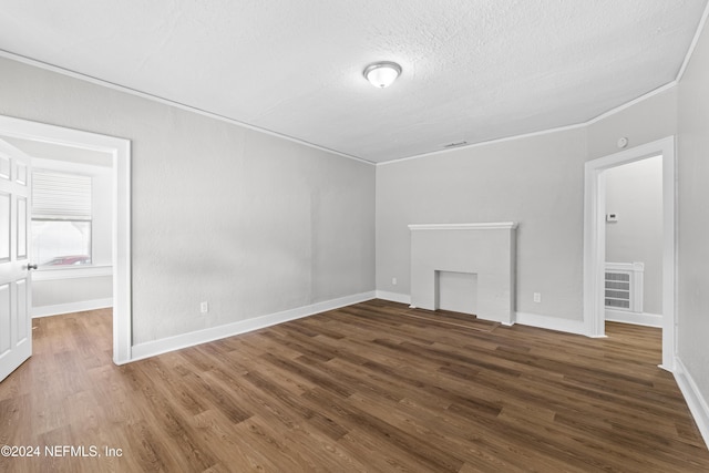 interior space featuring a textured ceiling and dark hardwood / wood-style floors