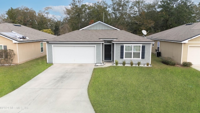 single story home featuring a garage and a front lawn