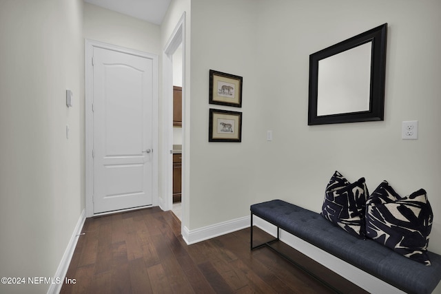 hall with dark hardwood / wood-style floors