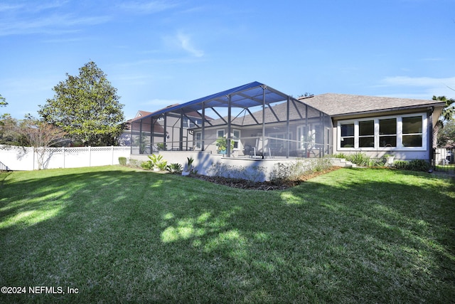 view of yard with glass enclosure