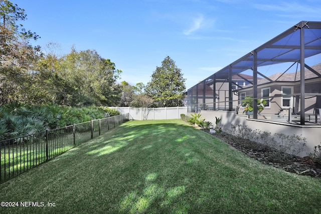 view of yard with glass enclosure