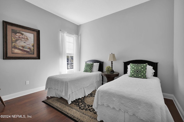 bedroom featuring dark hardwood / wood-style flooring