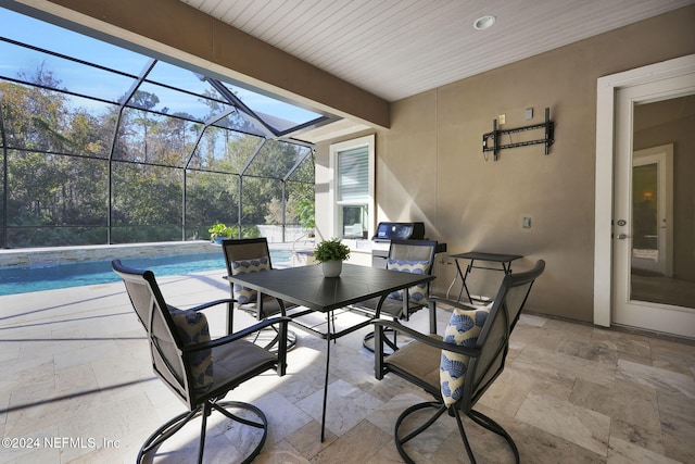 view of patio with a lanai