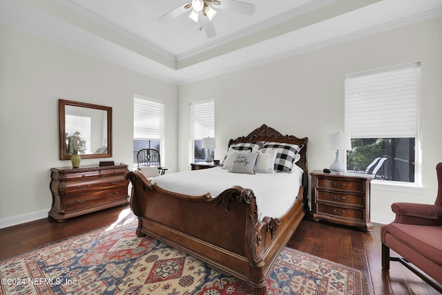 bedroom featuring ornamental molding, ceiling fan, and dark wood-type flooring