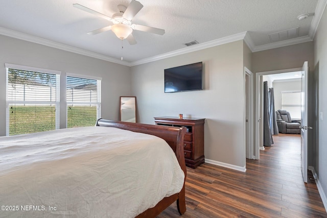 bedroom featuring a textured ceiling, ceiling fan, dark hardwood / wood-style floors, and crown molding