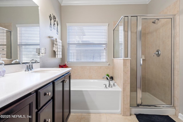 bathroom featuring tile patterned floors, crown molding, vanity, and independent shower and bath