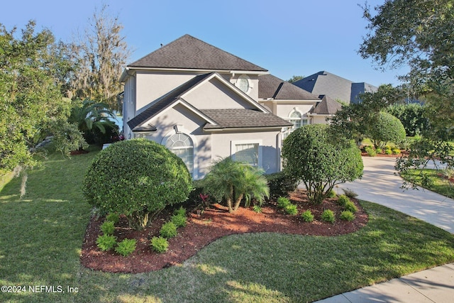 view of home's exterior with a yard