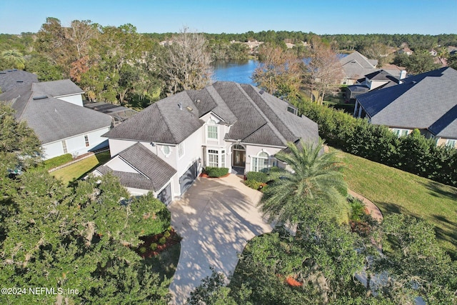 birds eye view of property with a water view