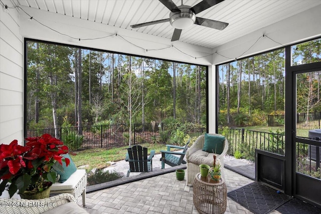 sunroom featuring a wealth of natural light and ceiling fan