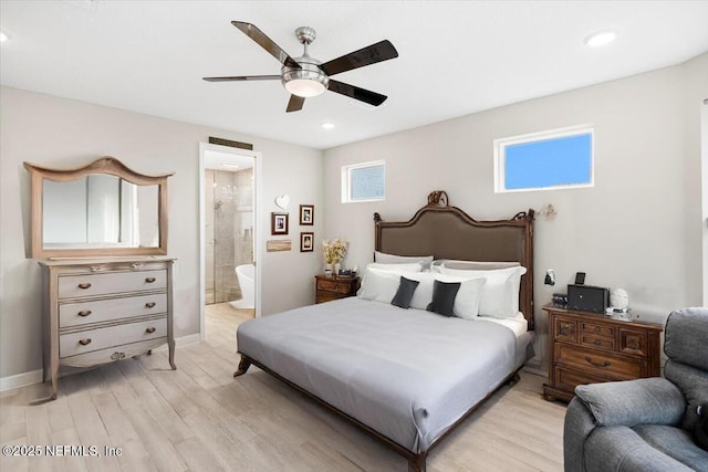 bedroom featuring ceiling fan, light wood-style flooring, baseboards, and ensuite bathroom