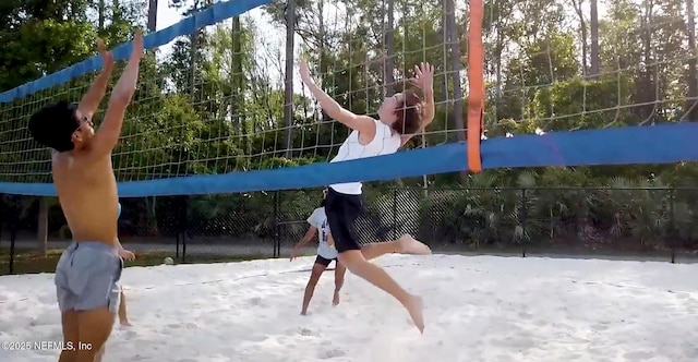 view of jungle gym with volleyball court