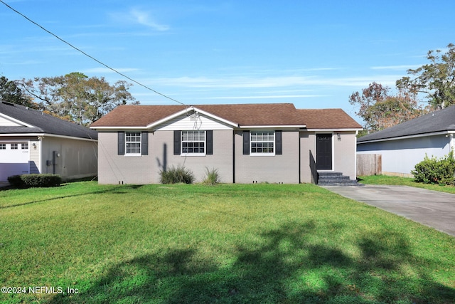 ranch-style house featuring a front lawn