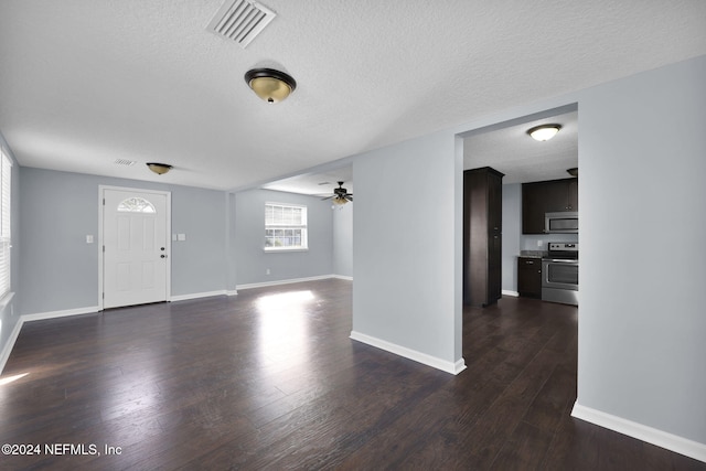 entrance foyer with ceiling fan, a textured ceiling, and dark hardwood / wood-style floors