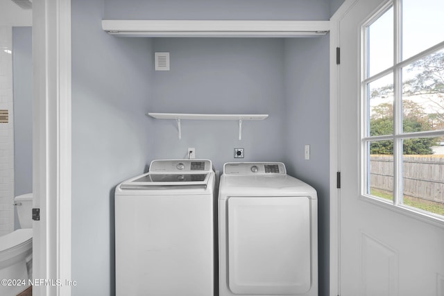 laundry room with washing machine and dryer