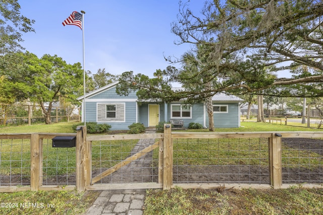 ranch-style home with a front lawn