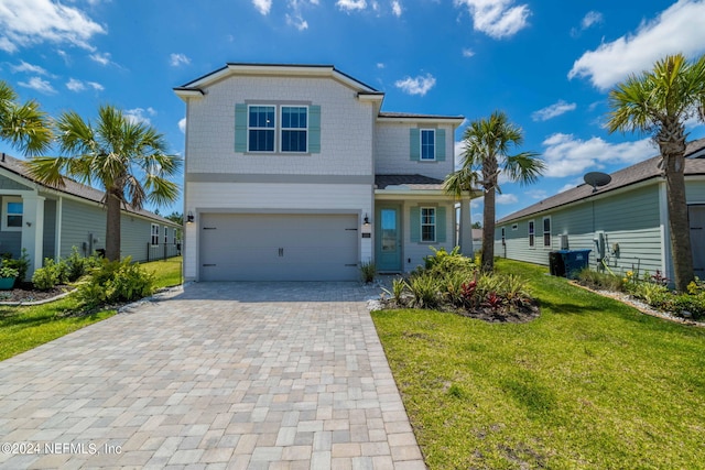 view of front facade with a front lawn and a garage