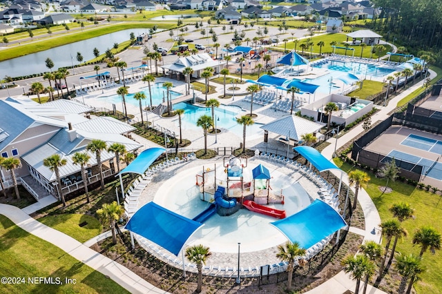 birds eye view of property featuring a water view