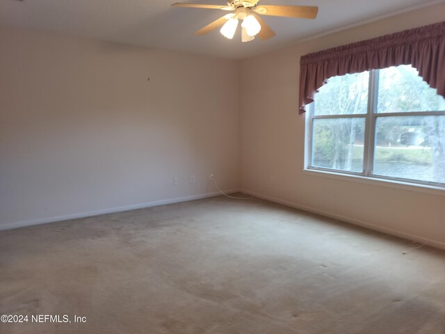 2546 Willow Creek Dr, Fleming Island, FL 32003 - unfurnished room with carpet floors and a ceiling fan