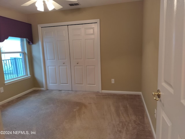 2546 Willow Creek Dr, Fleming Island, FL 32003 - unfurnished bedroom featuring carpet, a closet, and ceiling fan