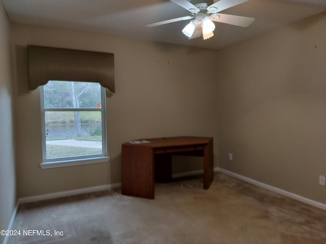 carpeted empty room with ceiling fan