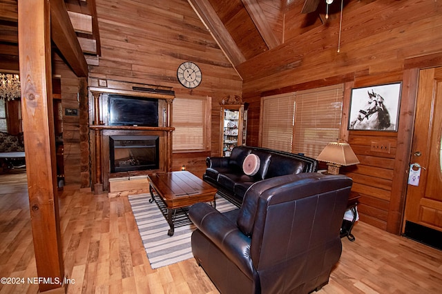 living room featuring wood ceiling, wooden walls, high vaulted ceiling, light hardwood / wood-style flooring, and beamed ceiling