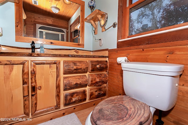 bathroom with toilet, wood ceiling, wood-type flooring, and wooden walls