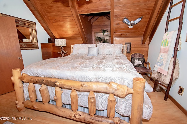 bedroom featuring light wood-type flooring, wood walls, and wood ceiling