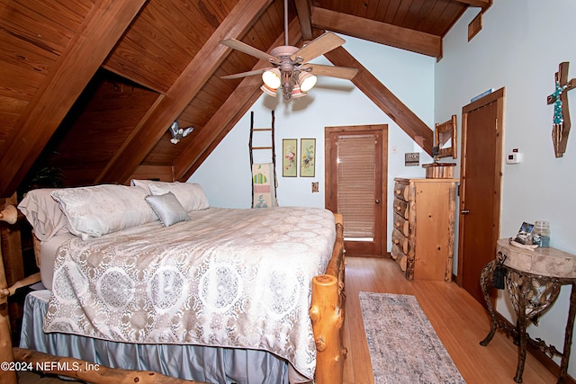 bedroom featuring ceiling fan, light hardwood / wood-style floors, wood ceiling, and lofted ceiling with beams