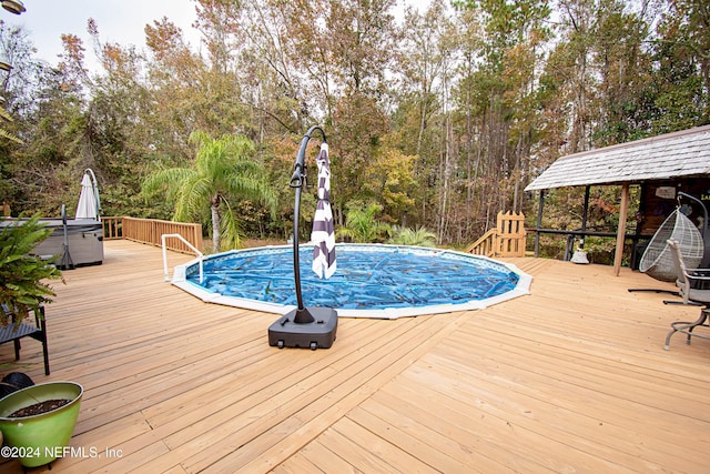 view of pool featuring a wooden deck