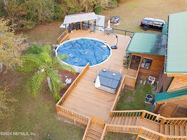 view of swimming pool featuring a deck