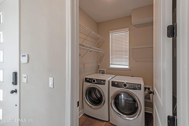 laundry area featuring hardwood / wood-style floors and independent washer and dryer