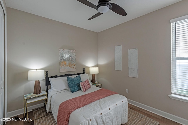 bedroom with ceiling fan and wood-type flooring