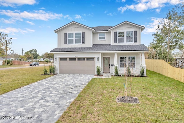 view of front facade featuring a garage and a front lawn