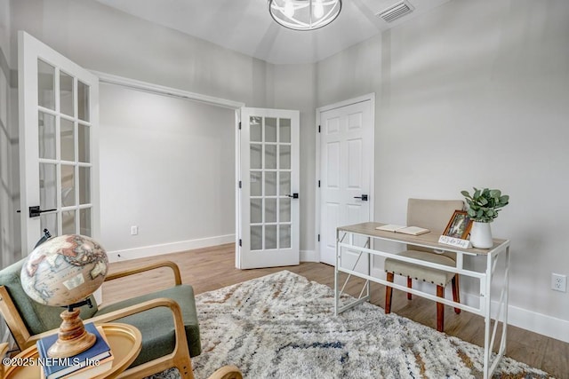 office area featuring wood-type flooring and french doors