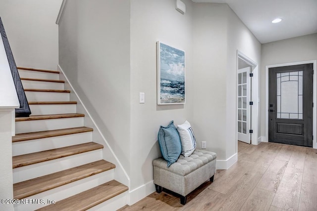 entryway with light hardwood / wood-style floors