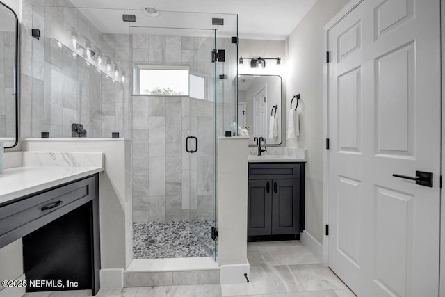 bathroom featuring vanity and an enclosed shower