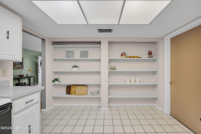 1 Farrington Ln, Palm Coast, FL 32137 - kitchen featuring open shelves, light countertops, white cabinetry, built in shelves, and stove