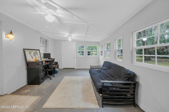 office featuring ceiling fan, concrete floors, and vaulted ceiling