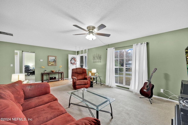 1 Farrington Ln, Palm Coast, FL 32137 - carpeted living room with a ceiling fan and a textured ceiling