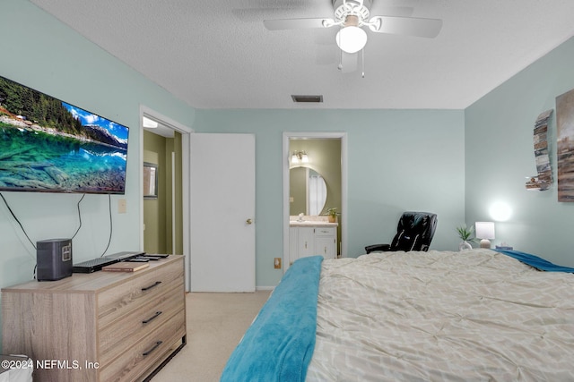1 Farrington Ln, Palm Coast, FL 32137 - carpeted bedroom with ensuite bathroom, ceiling fan, and a textured ceiling