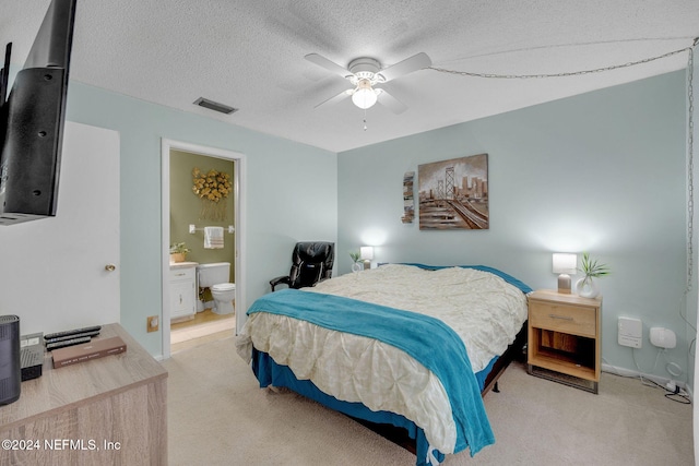 1 Farrington Ln, Palm Coast, FL 32137 - carpeted bedroom with a textured ceiling, connected bathroom, and a ceiling fan