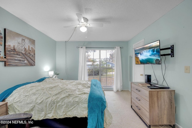 1 Farrington Ln, Palm Coast, FL 32137 - bedroom with light carpet, a textured ceiling, and a ceiling fan