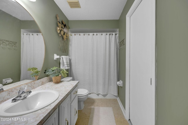 1 Farrington Ln, Palm Coast, FL 32137 - bathroom with vanity, tile patterned floors, and a textured ceiling
