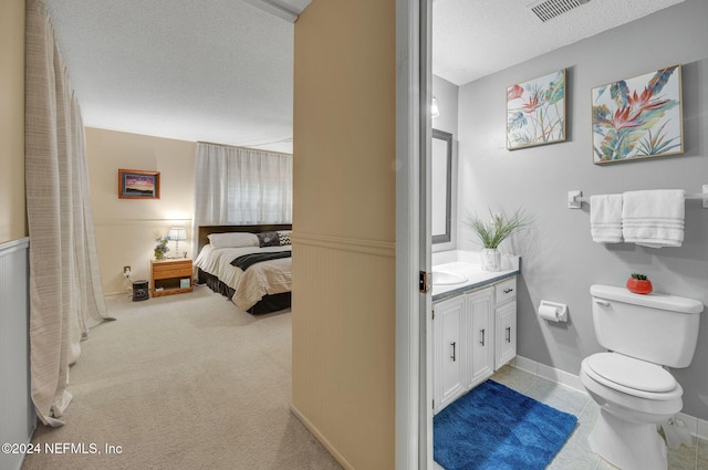 1 Farrington Ln, Palm Coast, FL 32137 - bathroom featuring vanity, wainscoting, and a textured ceiling