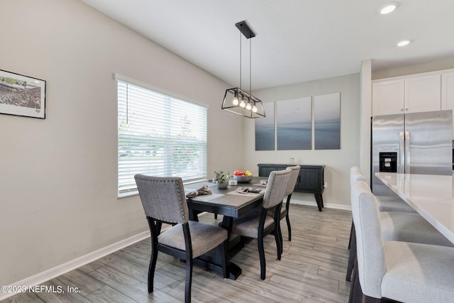 dining room with light hardwood / wood-style floors