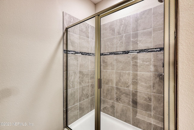 bathroom featuring an enclosed shower