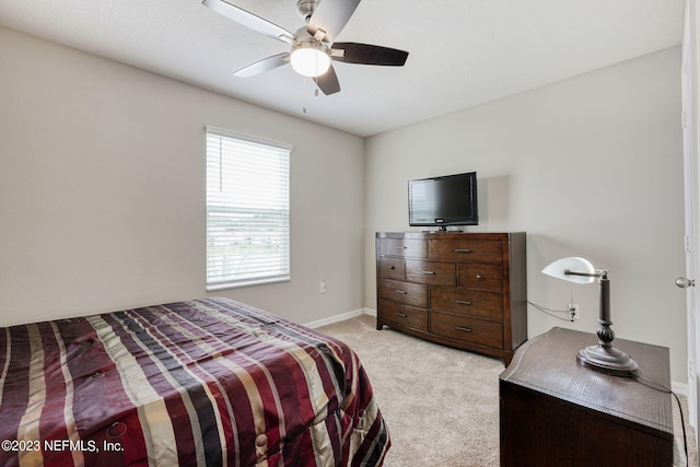 bedroom featuring ceiling fan and light colored carpet