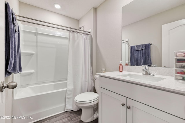 full bathroom featuring shower / bath combo, toilet, wood-type flooring, and vanity