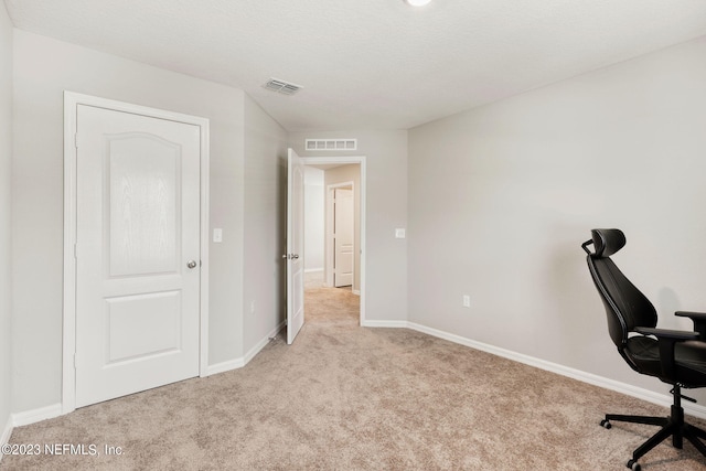 unfurnished office with light colored carpet